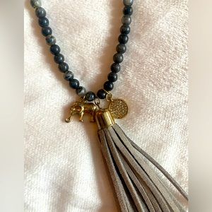 Gray fringe and pearl necklace with elephant charm